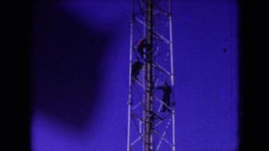 1966: Athens Ohio, USA. A Small Child Standing Next To A Man On A Couch.