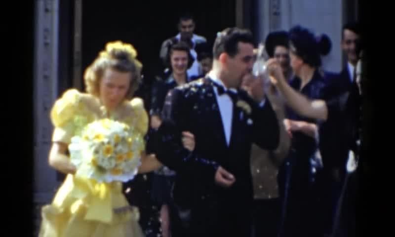1943: Bridgeport, Connecticut Wedding. A Woman In A Yellow Dress And A Man In A Tuxedo.