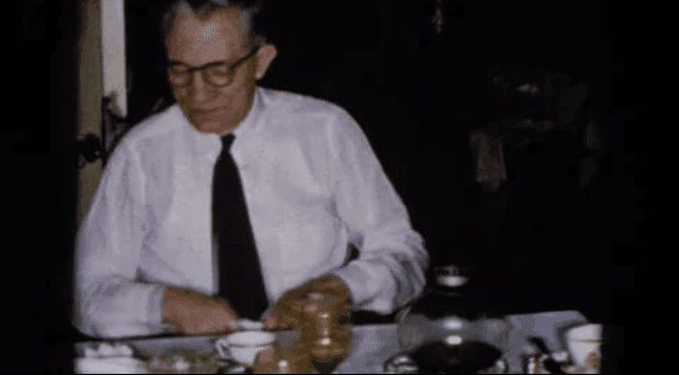 1957 Hicksville New York husband and wife enjoying a casual dinner.