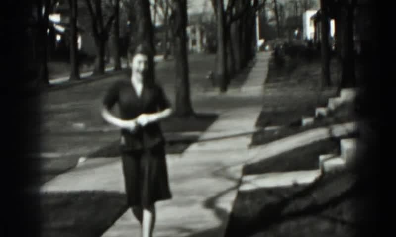 1946: Harrisburg PA. A Black And White Photo Of A Woman In A Dress.