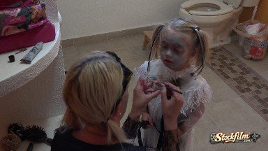 Colorado, United States: Mother Applying Make-up to her Daughter