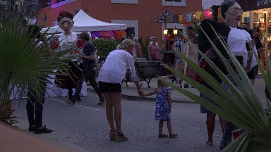 Mom & Daughter Watching the Street Halloween Events
