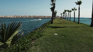 Manicured Grass Pathway in the Middle of the Sea