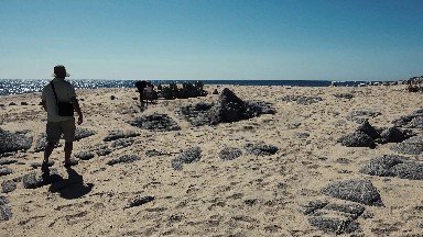 Father, Mother & Daughter Making Sandcastles