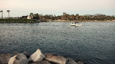 White Boat Traveling in Early Morning