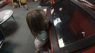 Little Girl Playing the Puppet Machine