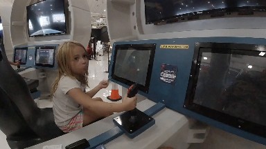 Little Girl Learns How to Use the Controllers