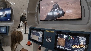 Toddler Working the Controls of Moon Rover. Denver, Colorado