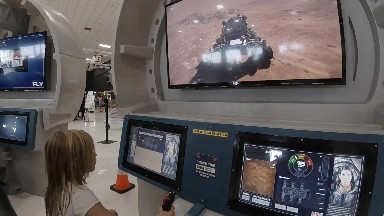 Toddler Working the Controls of Moon Rover. Denver, Colorado