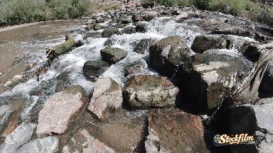 Water Flowing Over Rocks into A River. Denver, Colorado.
