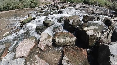 Water Flowing Over Rocks into A River. Denver, Colorado.