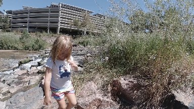 Little Girl Climbing Rocks in the City. Denver, Colorado