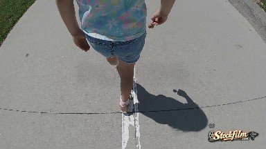 Little Girl Walking Down Sidewalk. Denver, Colorado.
