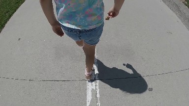 Little Girl Walking Down Sidewalk. Denver, Colorado.
