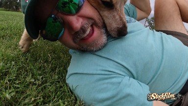 Man Wrestling With Dog. Denver, Colorado.