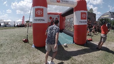 Man Kicking Soccer all into Inflatable Goal. Denver, Colorado.