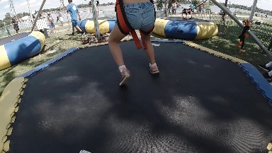 Child Jumping on Inflatable Bounce Pad. Denver, Colorado.