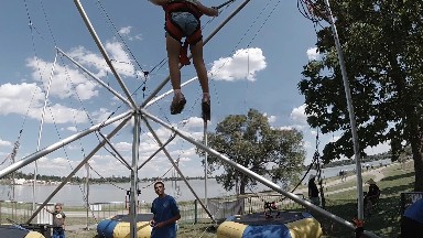 Little Girl on Bungee Carnival Attraction. Denver. Colorado