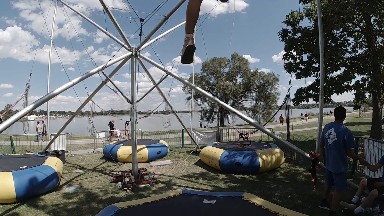 Little Girl Strapped Into Trampoline Jumper. Denver, Colorado.