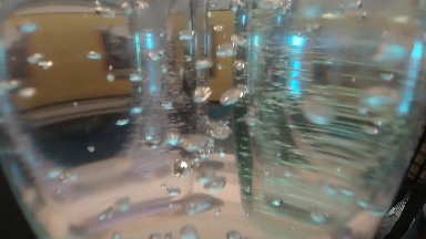 Close Up Of A Glass Air Bubbles In Water