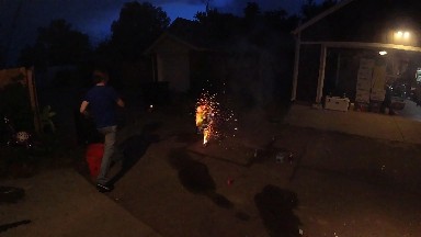 Are Lit Up In The Dark In A Backyard