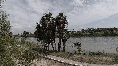 Boat That Is Sitting On The Shore Of The Lake