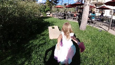 Little Girl That Is Walking In The Grass