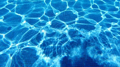 A Close Up Of A Pool With A Blue Water Ripples