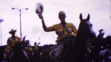 Indiana, USA. 1963: Men on Horses Dressed in Yellow in Parade