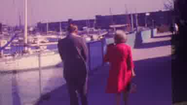 Honolulu Hawaii USA (1964): Group Of People In Formal Dress Walking Down A Marina