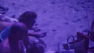 Palm Springs California USA (1964): Two People Are At The Beach Sitting On Their