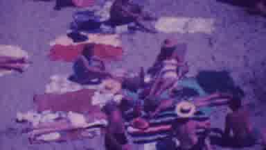 Palm Springs California USA (1964): Some Men And Women Are Sitting On Beach And