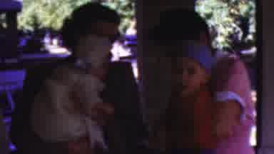 Wisconsin USA (1954): Happy Young Family Gathering Around Baby Celebrating