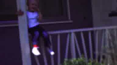 Wisconsin USA (1954): Child Throwing A Kiss While Sitting On The Railing