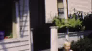 Wisconsin USA (1954): Child Playing In The Backyard With His Family