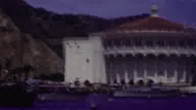 California USA (1961): A Boat Approaching The Shoreline Of A Landmark