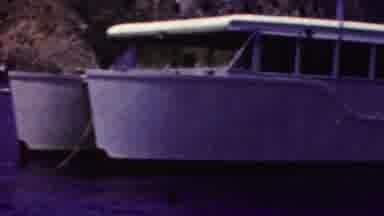 California USA (1961): White Boat Anchored On A Beautiful Coastline Of A Beach
