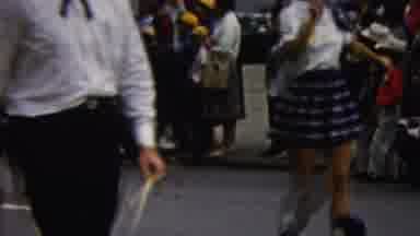 California USA (1961): A Marching Band Walking Down The Road In A Parade