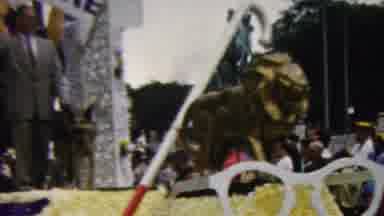 California USA (1961): A Man Standing On A Float In A Parade