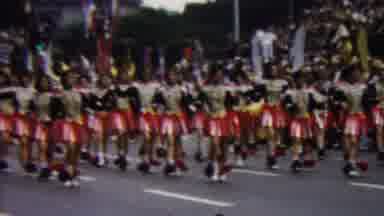 California USA (1961): Flag Corps Of Marching Band In A Parade