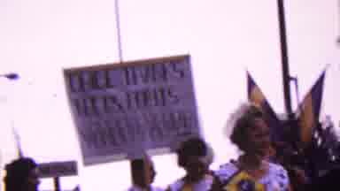 California USA (1961): People Are Marching In A Parade Holding Signs