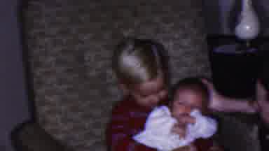 Cleveland Ohio USA (1953): Little Boy Happily Holding Baby On His Lap