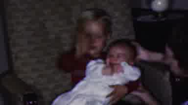Cleveland Ohio USA (1953): A Little Boy Holding A Baby And Sitting Near To Mother