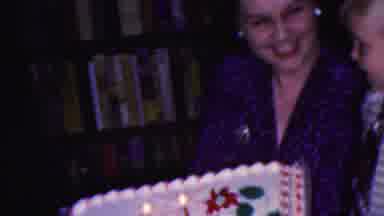 Cleveland Ohio USA (1953): Girl Blowing Out Candle On Her Birthday Cake