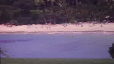 Hawaii USA (1962): Beachside People Swimming Sunbathing With Umbrellas Man Walking