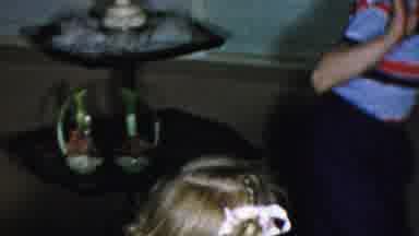 Columbus Ohio USA (1954): Little Girl Watching Little Boy Jump Up And Down At Home