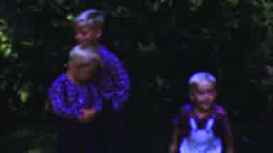 Seaside New Jersey USA (1949): Three Kids Jumping Around With Family