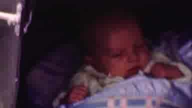 San Diego California USA (1955): Newborn Baby Wrapped Up In Blanket Waking Up