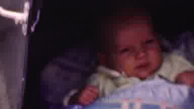 San Diego California USA (1955): Newborn In A Bed All Tucked In Blinking His Eyes