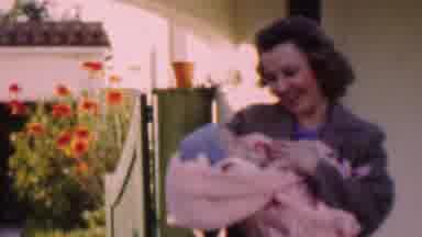 San Diego California USA (1955): Mother Pampering Her Baby While Outside Getting